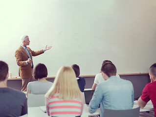 Image showing teacher with a group of students in classroom