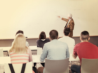 Image showing teacher with a group of students in classroom