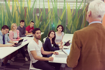 Image showing teacher with a group of students in classroom