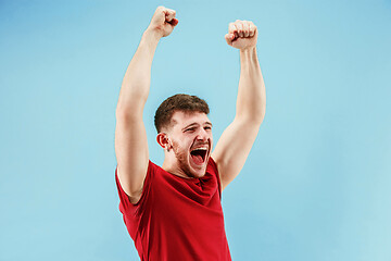 Image showing Winning success man happy ecstatic celebrating being a winner. Dynamic energetic image of male model