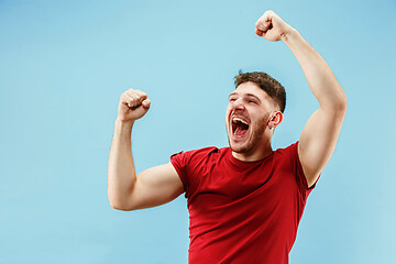 Image showing Winning success man happy ecstatic celebrating being a winner. Dynamic energetic image of male model