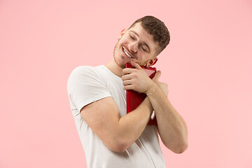 Image showing Businessman hugging laptop