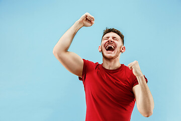 Image showing Winning success man happy ecstatic celebrating being a winner. Dynamic energetic image of male model