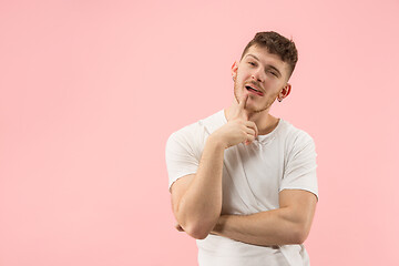 Image showing Young serious thoughtful businessman. Doubt concept.