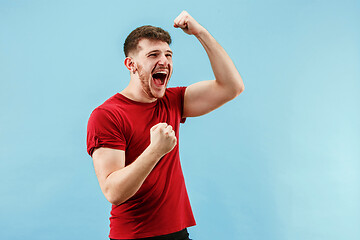 Image showing Winning success man happy ecstatic celebrating being a winner. Dynamic energetic image of male model