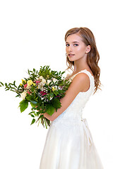 Image showing beautiful girl in white dress with big bouquet