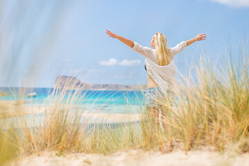 Image showing Free Happy Woman Enjoying Sun on Vacations.