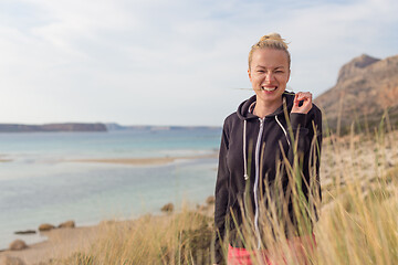 Image showing Relaxed Happy Woman Enjoying Walk on Beach