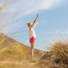 Image showing Free Happy Woman Enjoying Sun on Vacations.