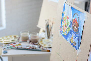 Image showing artist\'s workplace with an easel on which hangs still life