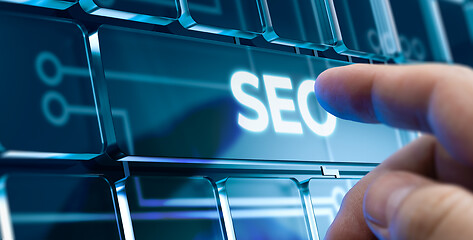 Image showing SEO - Man Pushing Button on Futuristic Interface.