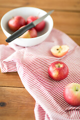 Image showing apples and kitchen knife on towel