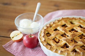 Image showing apple pie with ice cream on wooden table