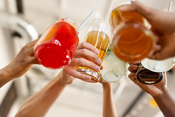 Image showing friends clinking glasses at bar or restaurant