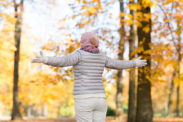 Image showing happy woman enjoying beautiful autumn