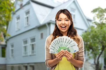 Image showing asian woman with hundred euro money banknotes