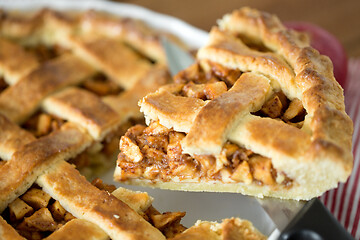 Image showing close up of apple pie piece on kitchen knife