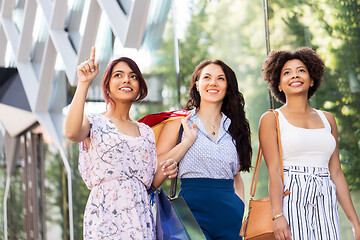 Image showing happy women with shopping bags in city