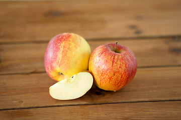 Image showing ripe red apples on wooden table