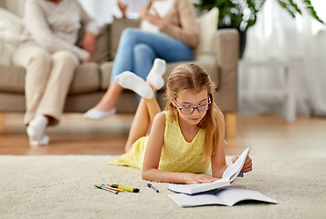 Image showing student girl with textbook learning at home