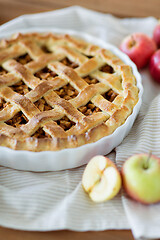 Image showing close up of apple pie in baking mold on towel