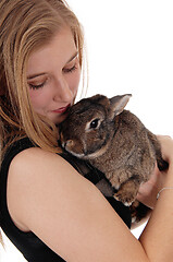 Image showing Young woman holding small rapid in her arms