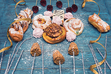 Image showing Different cookies on blue wooden