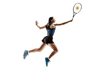 Image showing Full length portrait of young woman playing tennis isolated on white background