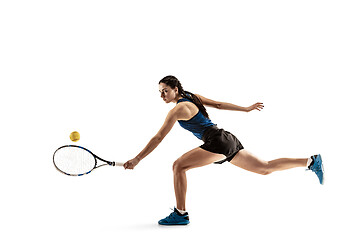 Image showing Full length portrait of young woman playing tennis isolated on white background