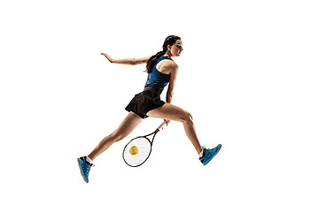 Image showing Full length portrait of young woman playing tennis isolated on white background