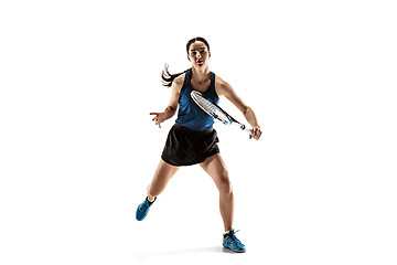 Image showing Full length portrait of young woman playing tennis isolated on white background