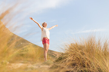 Image showing Free Happy Woman Enjoying Sun on Vacations.