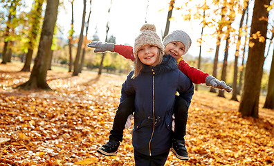 Image showing happy children having fun at autumn park