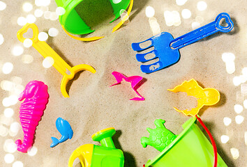 Image showing close up of sand toys kit on summer beach