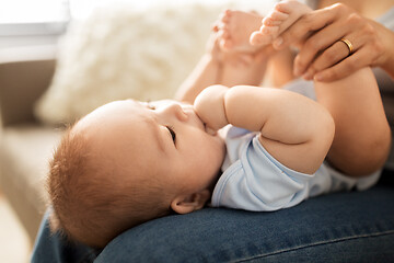 Image showing close up of little asian baby boy and mother