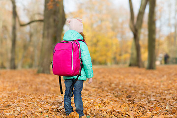 Image showing little girl with school bag at autumn park