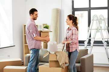 Image showing happy couple with stuff moving to new home