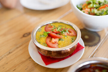 Image showing close up of vegan tarka dal in bowl on table