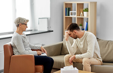 Image showing senior woman psychologist and sad man patient