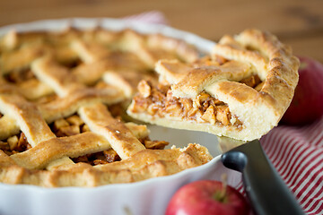 Image showing close up of apple pie piece on kitchen knife