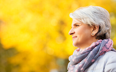 Image showing portrait of happy senior woman at autumn park