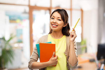 Image showing asian student woman with books and pencil