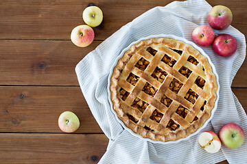 Image showing apple pie in baking mold on wooden table