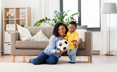 Image showing mother and baby playing with soccer ball at home