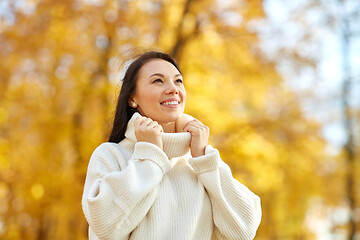 Image showing portrait of happy young woman in autumn park