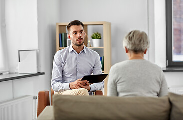 Image showing psychologist listening to senior woman patient