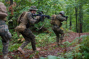 Image showing Modern warfare Soldiers  Squad  in battle