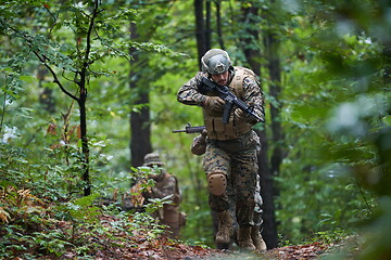 Image showing Modern warfare Soldiers  Squad  in battle