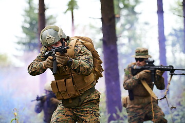 Image showing Modern warfare Soldiers  Squad  in battle