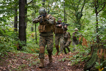 Image showing Modern warfare Soldiers  Squad  in battle